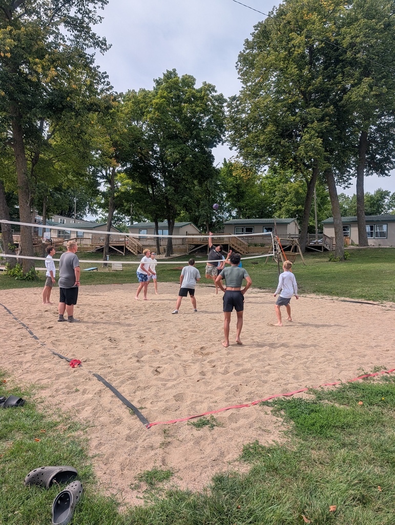 people playing sand volleyball