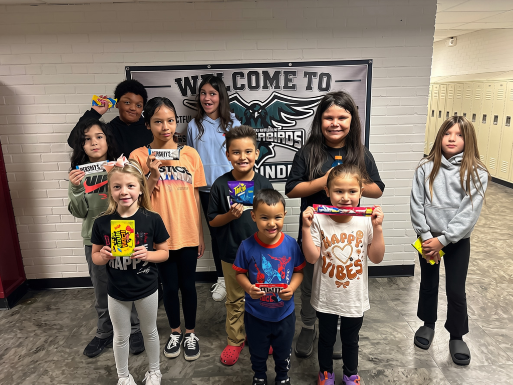 Students standing with candy