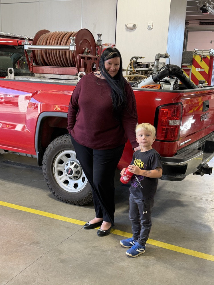 people standing by a fire truck