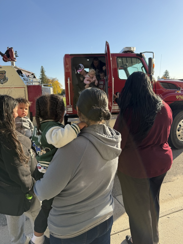 children getting out of a fire truck