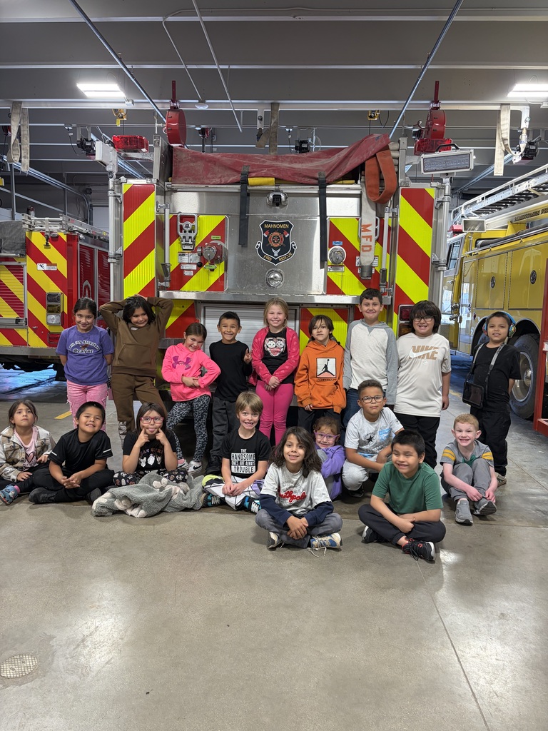 students by a fire truck