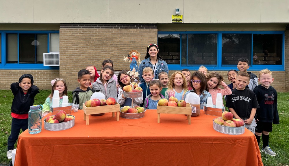 Kindergartners at Austin Road Elementary School recently got a hands-on lesson in how apples become apple cider when environmental educators from the New Canaan Nature Center visited their school.
