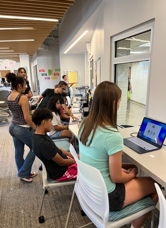 MCSD technicians distribute MacBook Neos