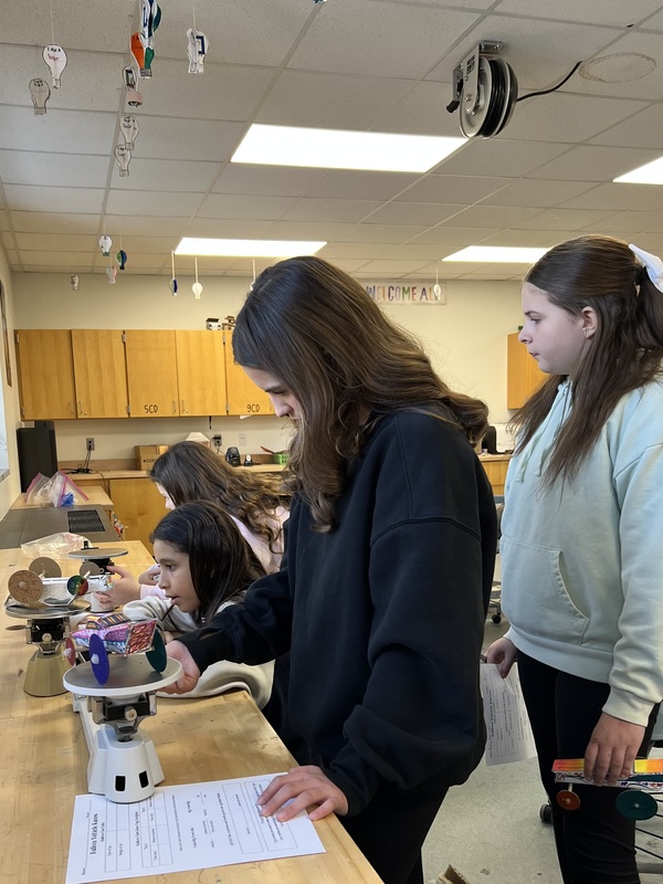 Creativity and Science Collide in Sixth Grade Balloon Car Project