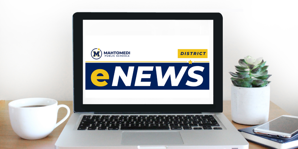 Laptop with eNews on desk