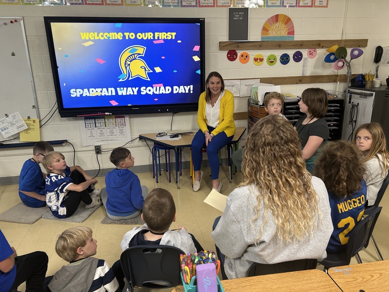 Teacher addresses students in group setting