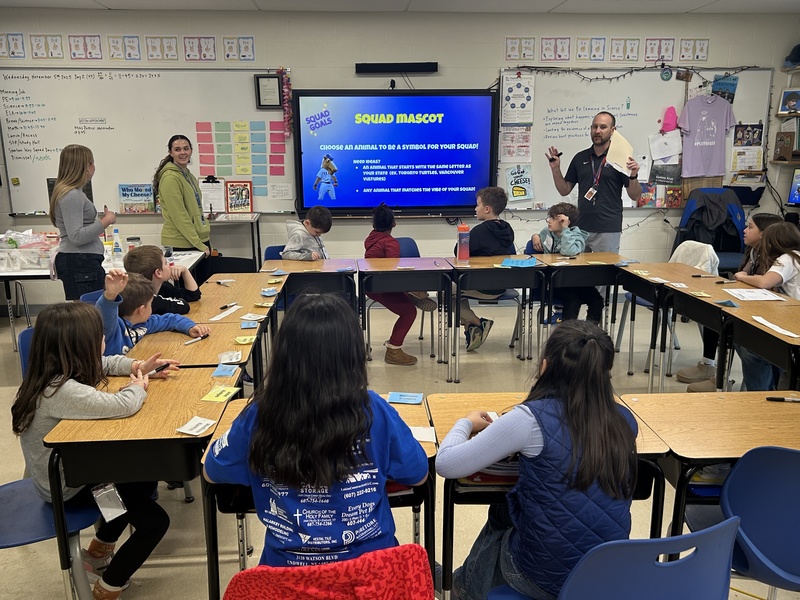 Teacher addresses students in group setting