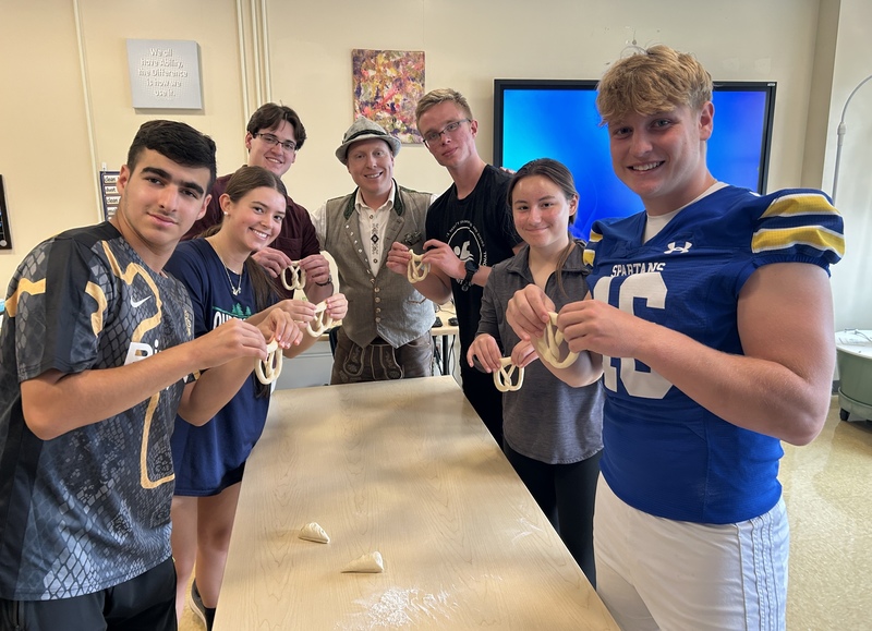 students holding pretzal