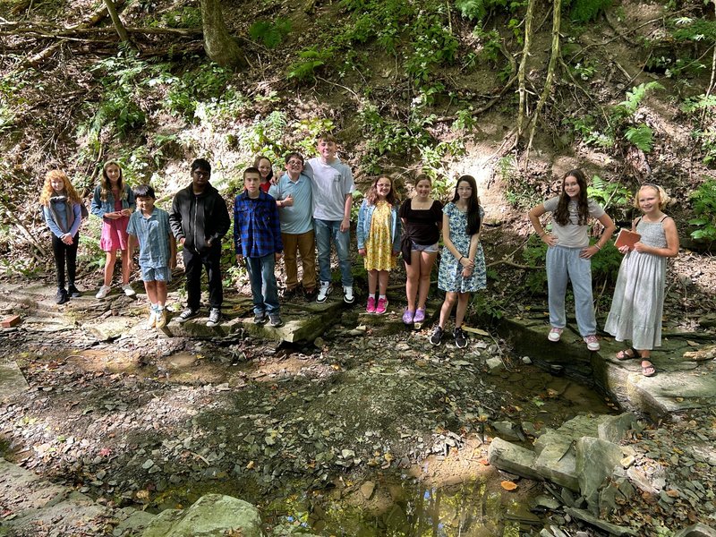 kids stnaind in creek