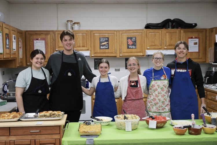 Mrs. Ostrand’s Foods 2 students before serving food at the staff picnic  