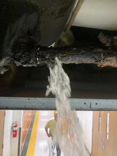 water poring out of ceiling