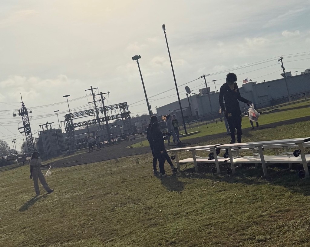 Students picking up trash at the track