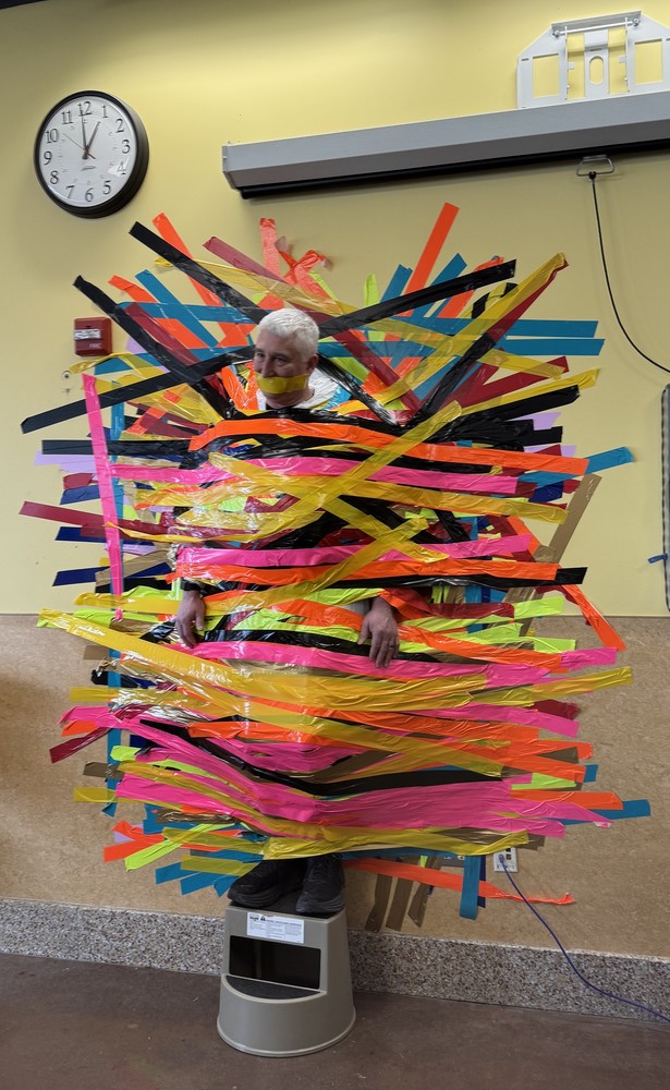 Assistant Principal, Mr. Joey Santamoor, taped to the wall