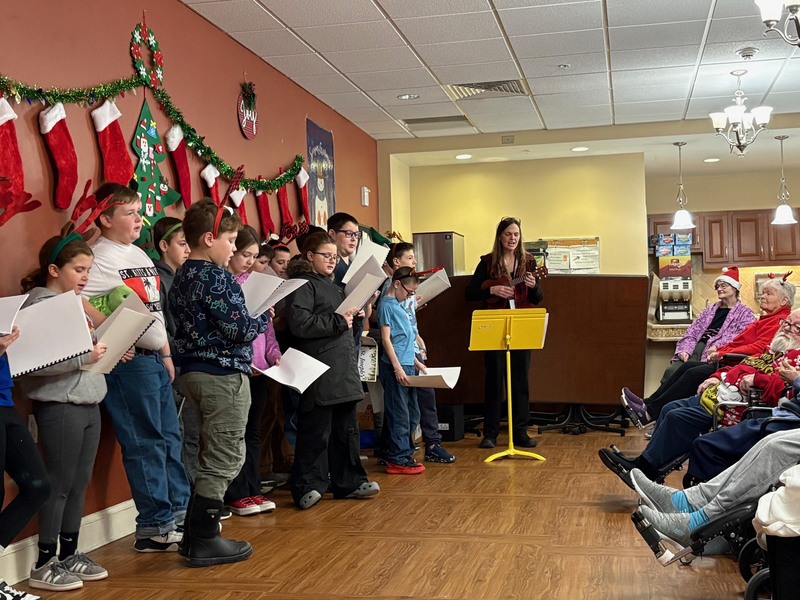 St. Joe's students singing at the Farrar Home