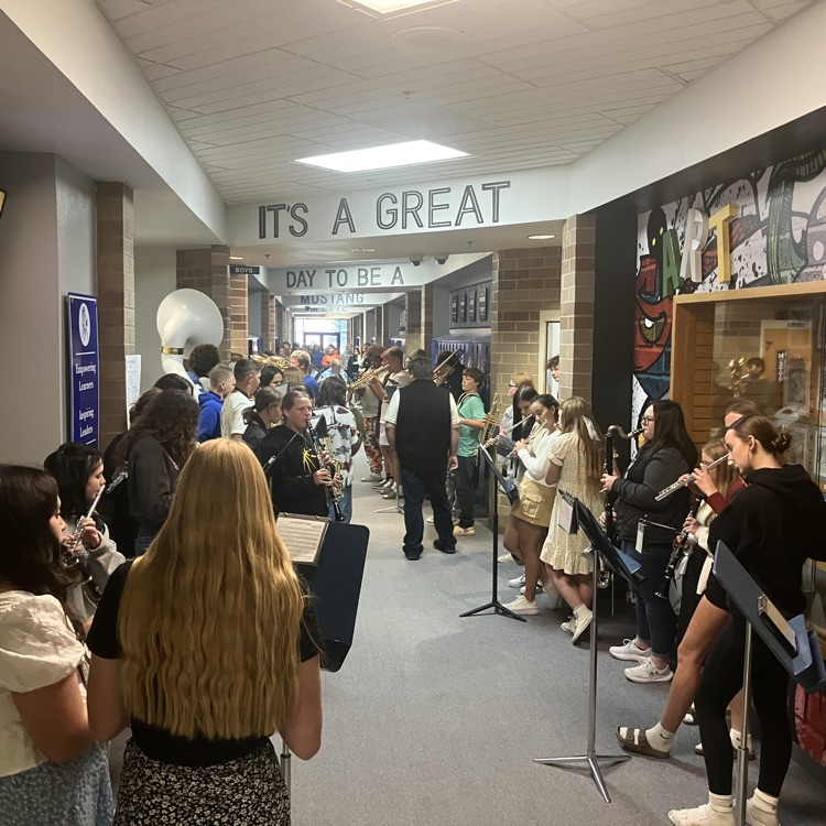 Pep band playing in hallway of school