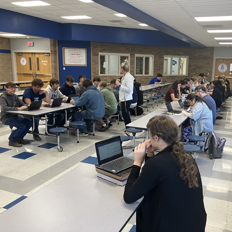students using computers to fill out college applications.   