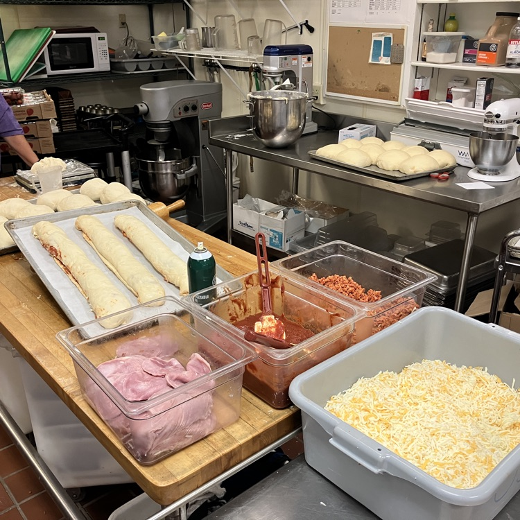 lunch ladies making Stromboli 