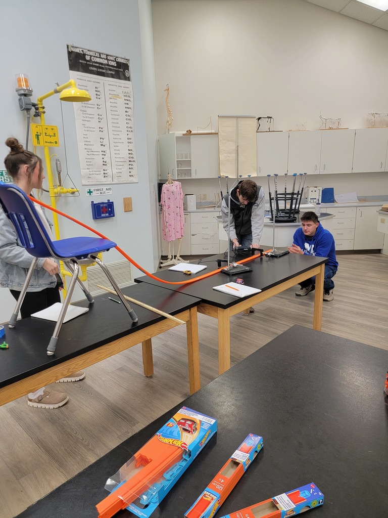 Students conducting a lab with Hot Wheels Cars