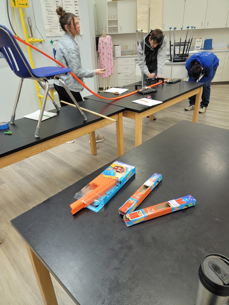 Students conducting a lab with Hot Wheels Cars