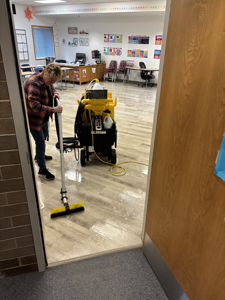 MHS custodian works hard to keep floors clean, polished, and well-maintained.