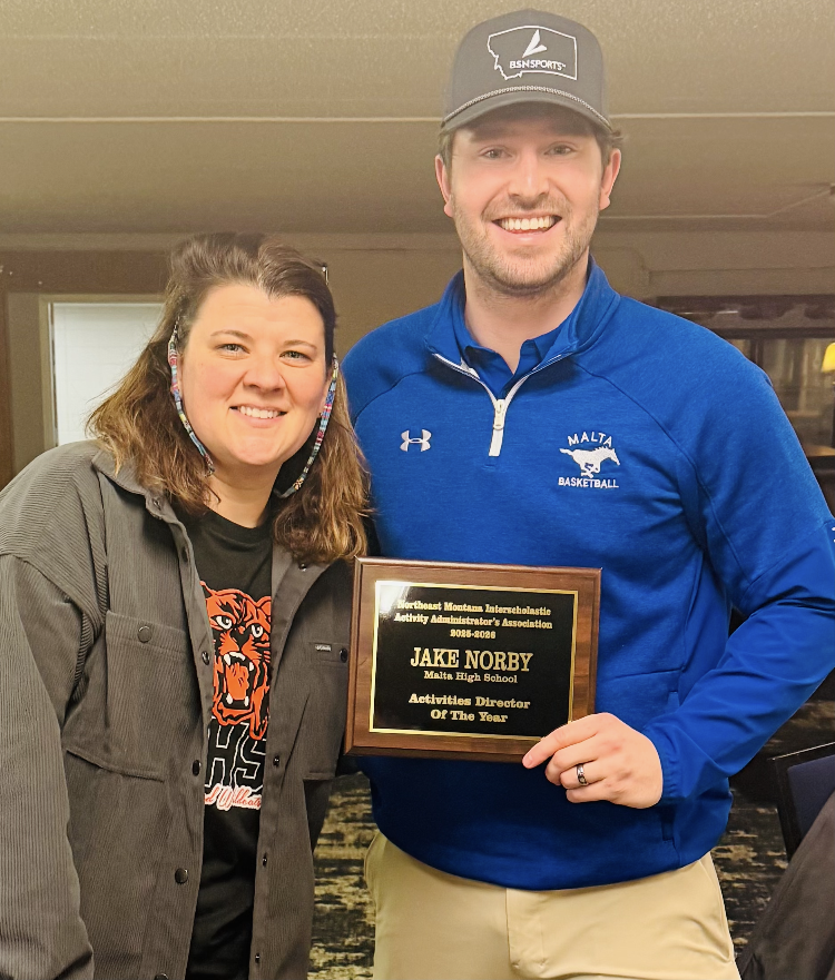 photo of Mr. Norby being presented an award
