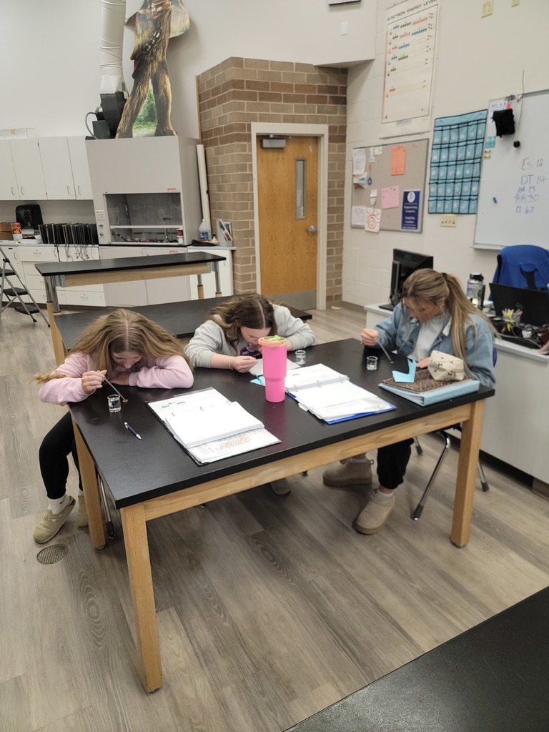 Chemistry students learning how to stack water.