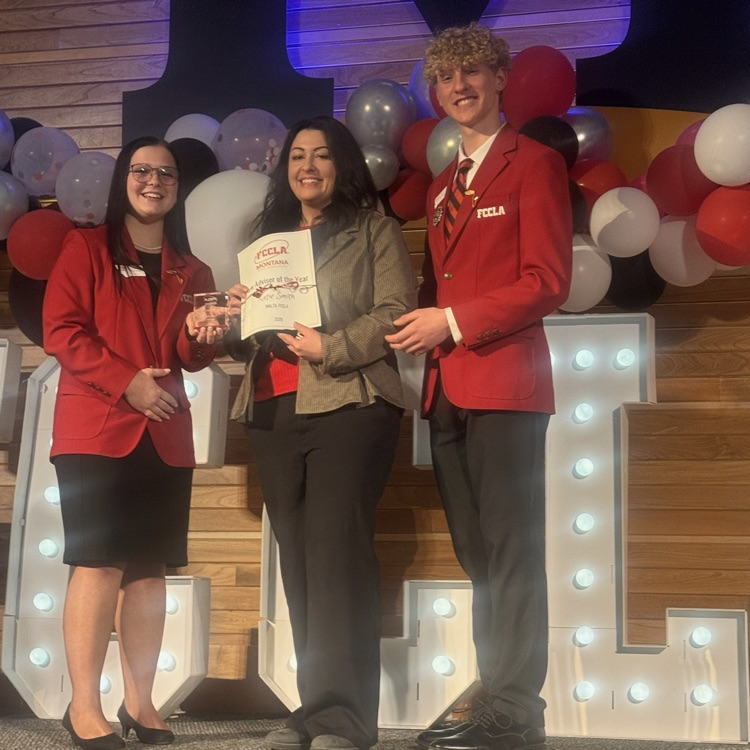 teacher receiving an award.