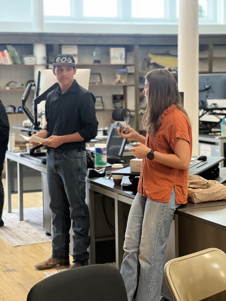 Travis and Maida presenting his work
