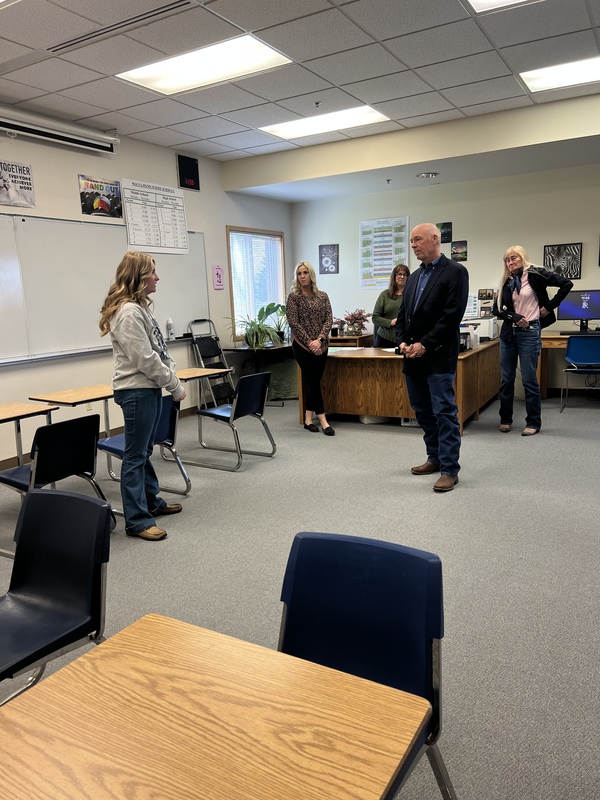 student visiting with the governor