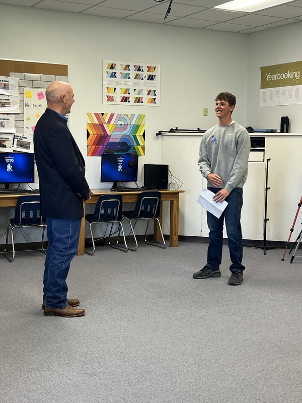 student visiting with the governor