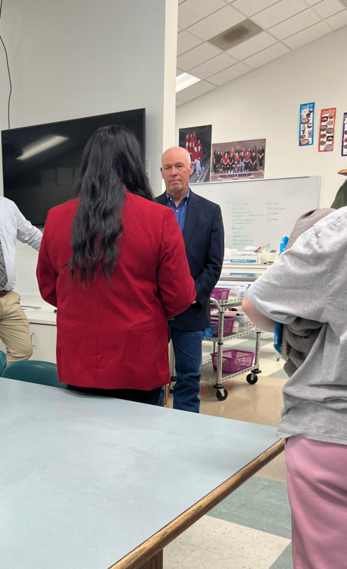 student visiting with the governor