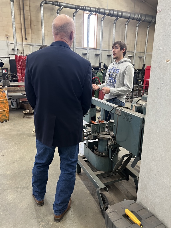 student visiting with the governor