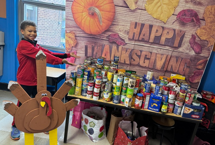 student showing food donations