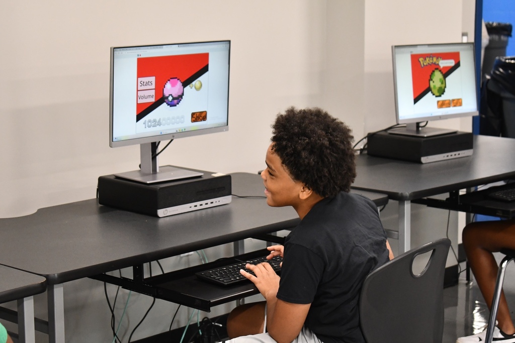 Student with a computer learning coding