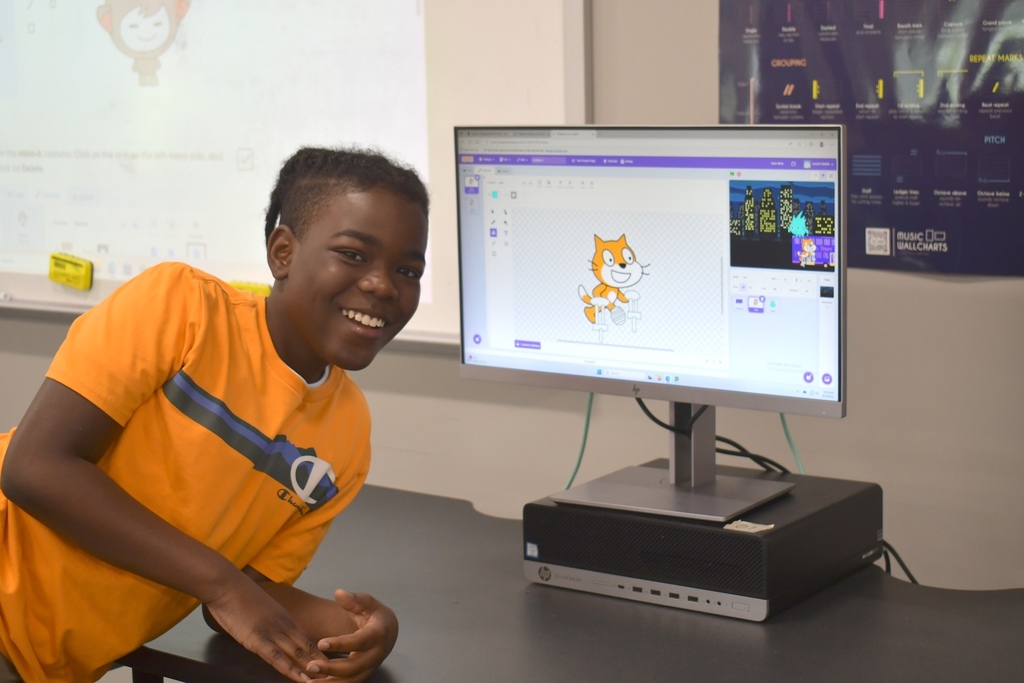 Student with a computer learning coding