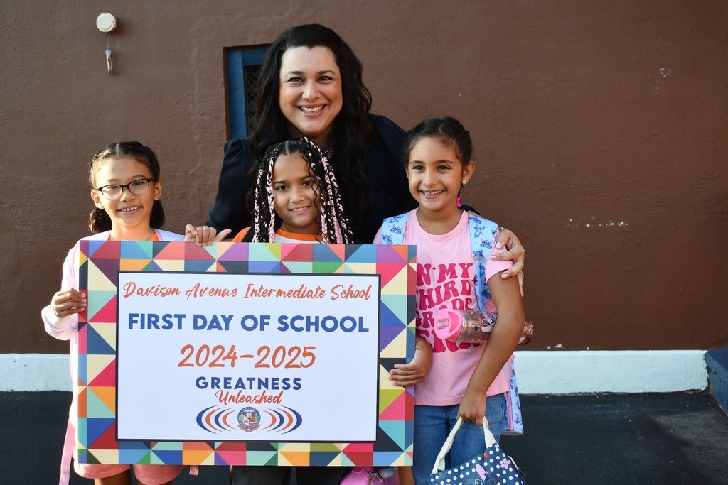 Students with the principal on the first day of school