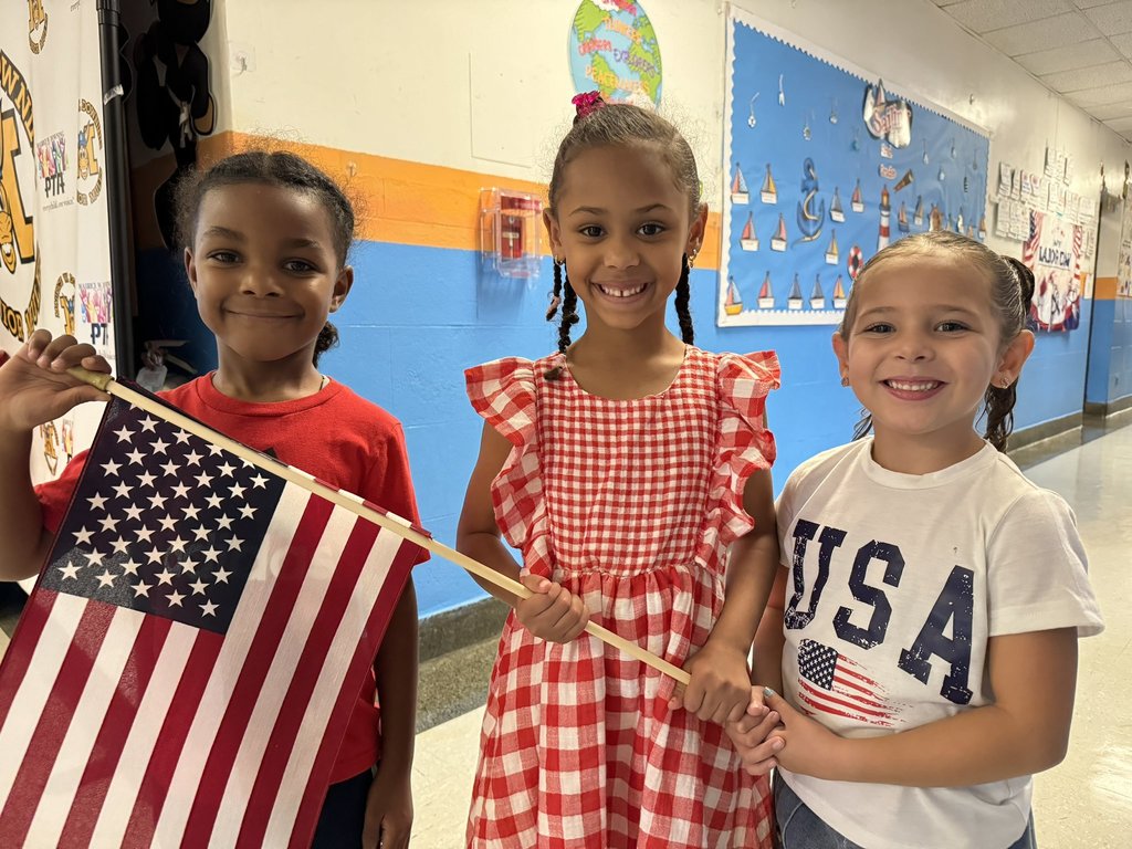 Students holding an American flag