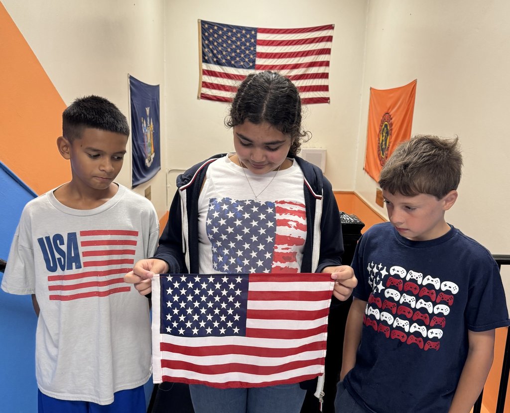 Students holding an American flag