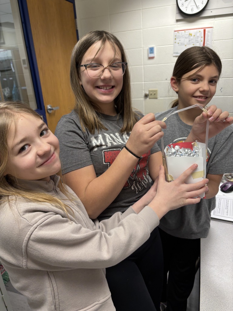 4th grade girls winning stem challenge with 220 kisses in their box!