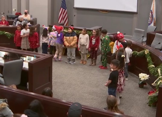 Manchester DLI students perform at board meeting