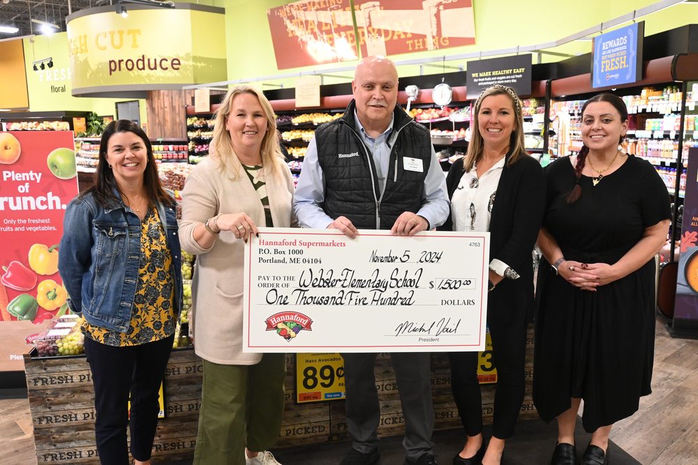 webster school and district staff accept a donation from Hannaford to start a new food pantry at webster