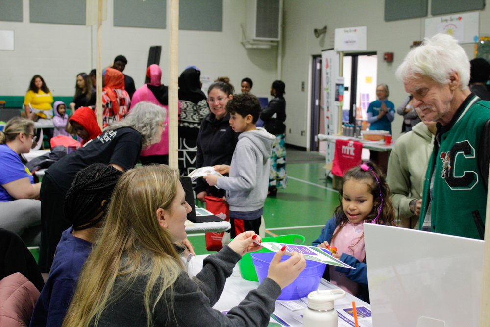 crowd photo from 2024 spring into summer resource fair event at beech street school