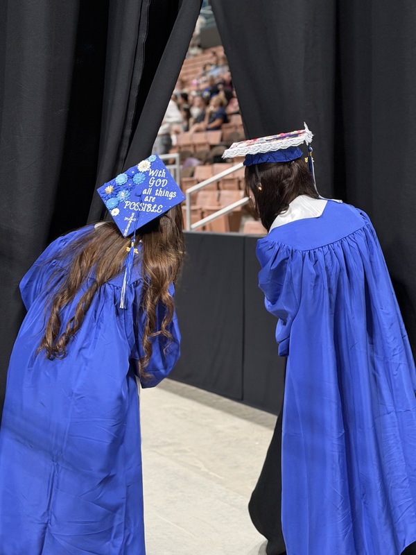 West grads peek through curtain