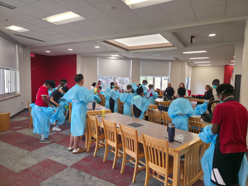 Students race to dress in PPE during NextGen presentation