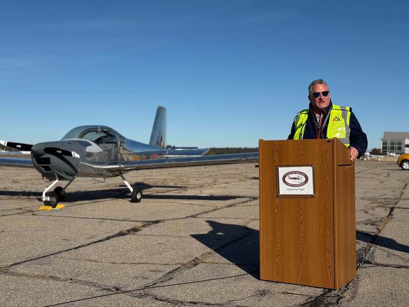 MHT aviation teacher jeff sullivan at plane ceremony at MHT