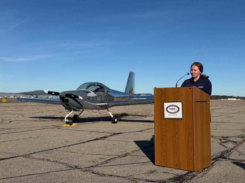 Student Katrina Maglio in front of completed MST airplane