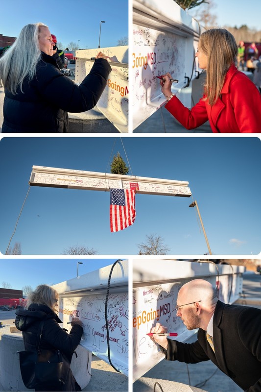 district leaders sign beem at mclaughlin topping off ceremony
