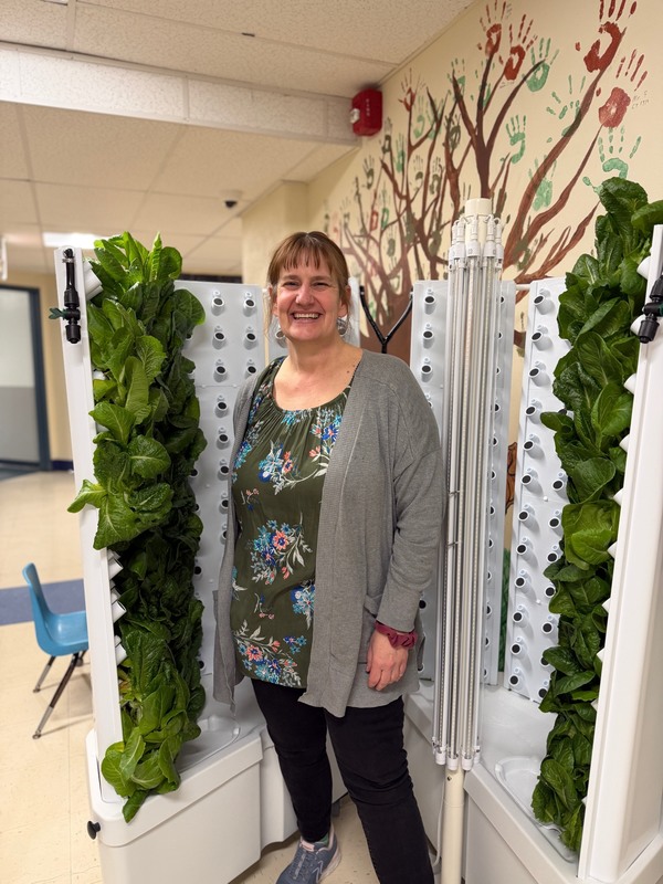 Mrs. Green with hydroponic machine
