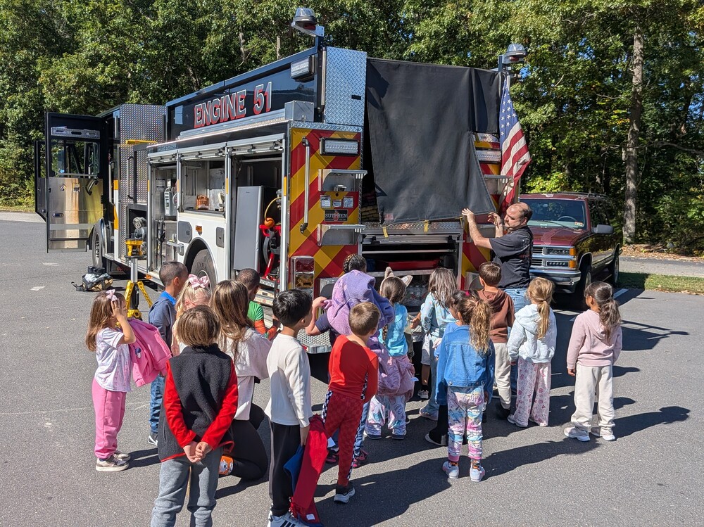 MTES students stand around a firetruck