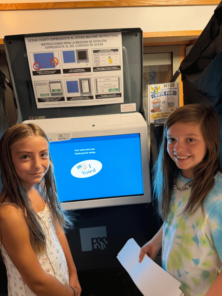 Students at the voting booth